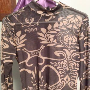 Tan and black body suit.